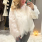 The Vogue beaded faux fur coat
