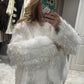 The Vogue beaded faux fur coat